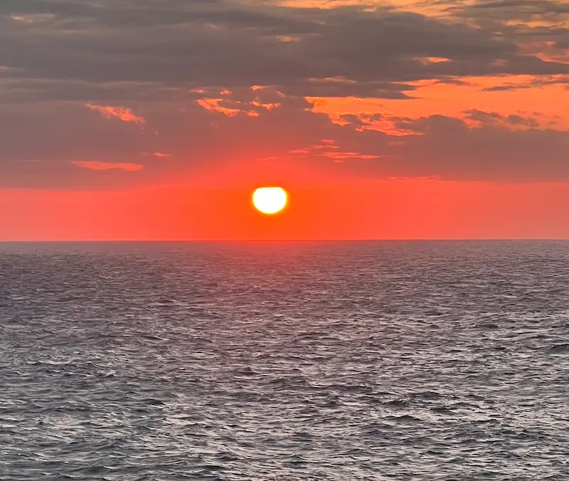 Spectacular sunset over the Mediterranean Sea horizon, viewed from the Cala Morell area near Villa Arrow.